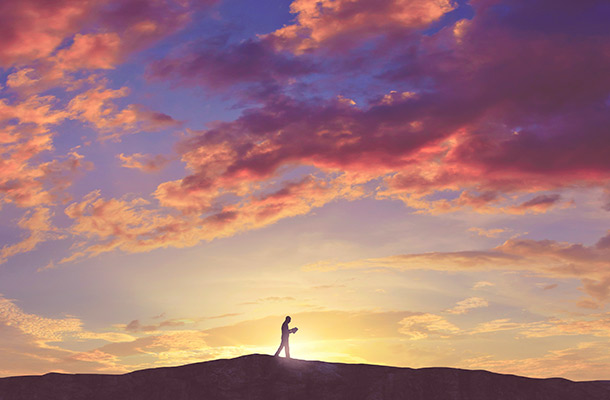 man
                  walking in sunset by Kevin Carden